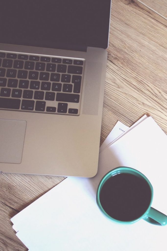 Computer and coffee on a desk- for contact page of - thechurchadmin.com